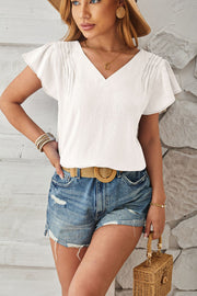 White textured V-neck blouse with pleated flutter sleeves