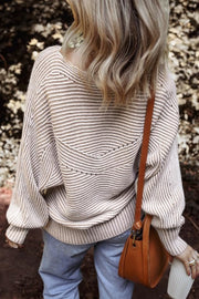 Textured stripe batwing knit sweater in taupe with V-shaped detail and balloon sleeves.