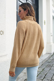 Camel ribbed turtleneck sweater with raglan sleeves.
