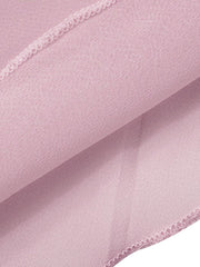 Backless sheer chiffon mini dress in pale pink with draped fabric detail.