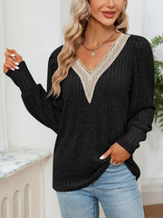 Black ribbed knit sweater with lace trim V-neck and long sleeves.