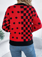 Red acrylic knit sweater with checkerboard and dot intarsia patterns.