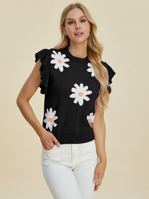 Black knit blouse with white daisy print and ruffled cap sleeves.