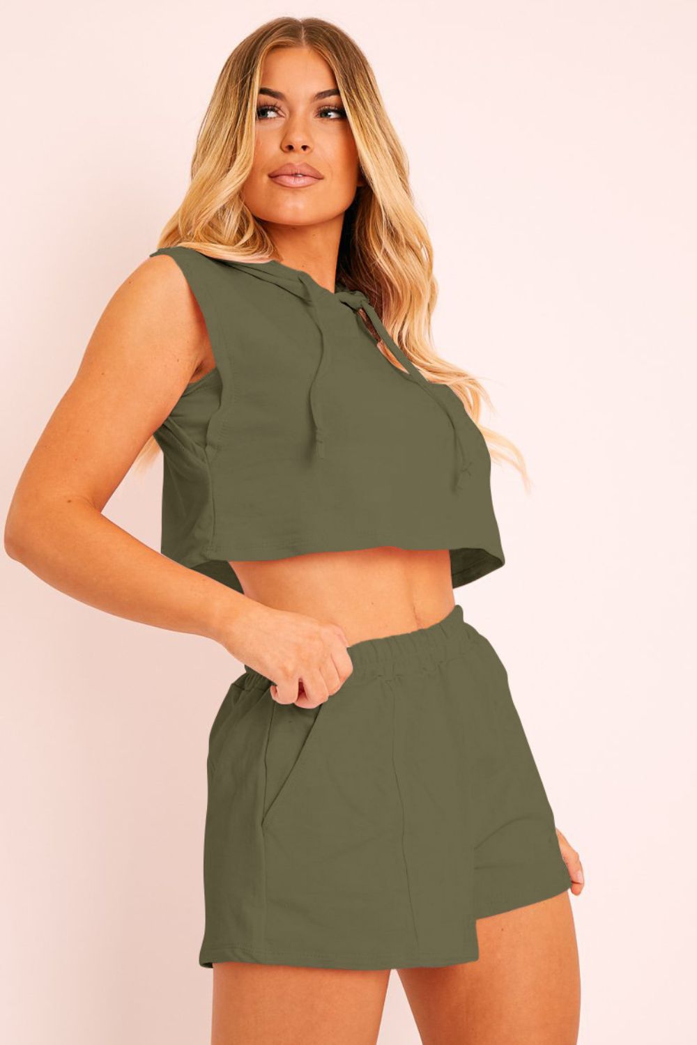 Army green sleeveless crop hoodie and boxer short set with drawstring hood.