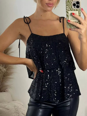 Black sequin cami top with tie shoulders and tiered hem.