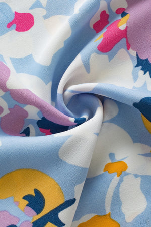 Light blue floral print blouse with pink, purple, yellow, and navy accents.