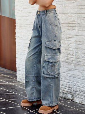 Light wash denim cargo pants with pleated waist and multiple utility pockets.