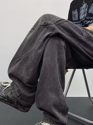 Gray oversized drawstring jeans with a relaxed fit and cargo pockets.