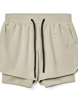 Khaki layered performance shorts with black drawstring and perforated panels.