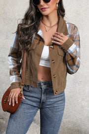 Brown corduroy jacket with plaid patchwork sleeves and button front.