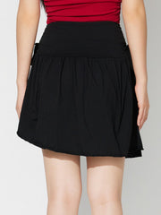 Black draped wrap mini skirt with tie detail and gathered waist