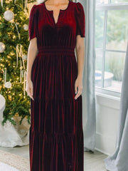 Wine red velvet maxi dress with tiered skirt and smocked waist.