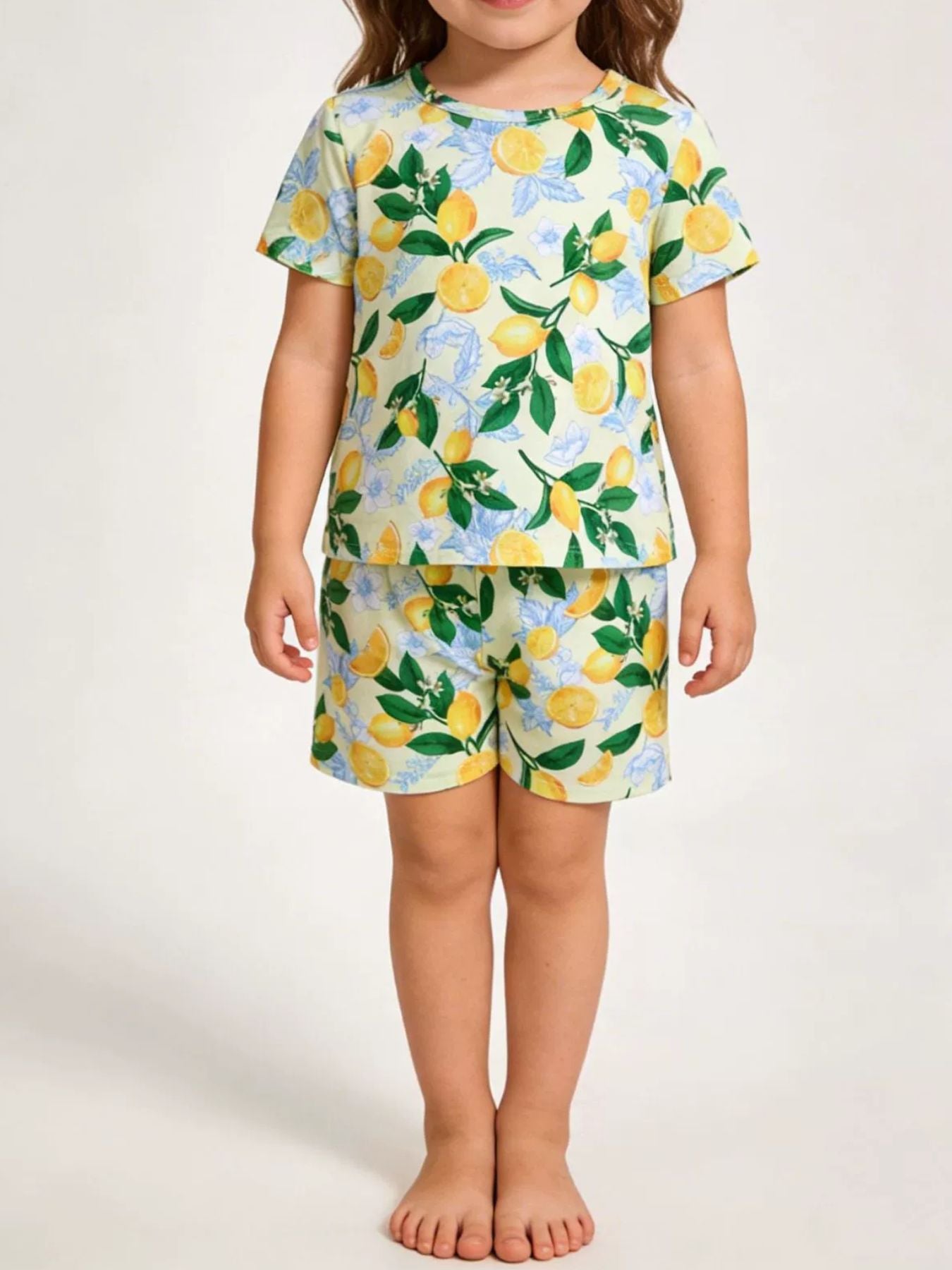 Toddler lemon print tee and shorts set with crew neck and short sleeves.