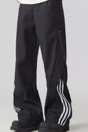 Black wide-leg sweatpants with white side stripes and a zipper detail.