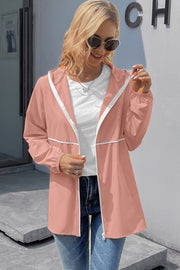 Blush pink hooded rain jacket with white trim and zipper, elastic cuffs.