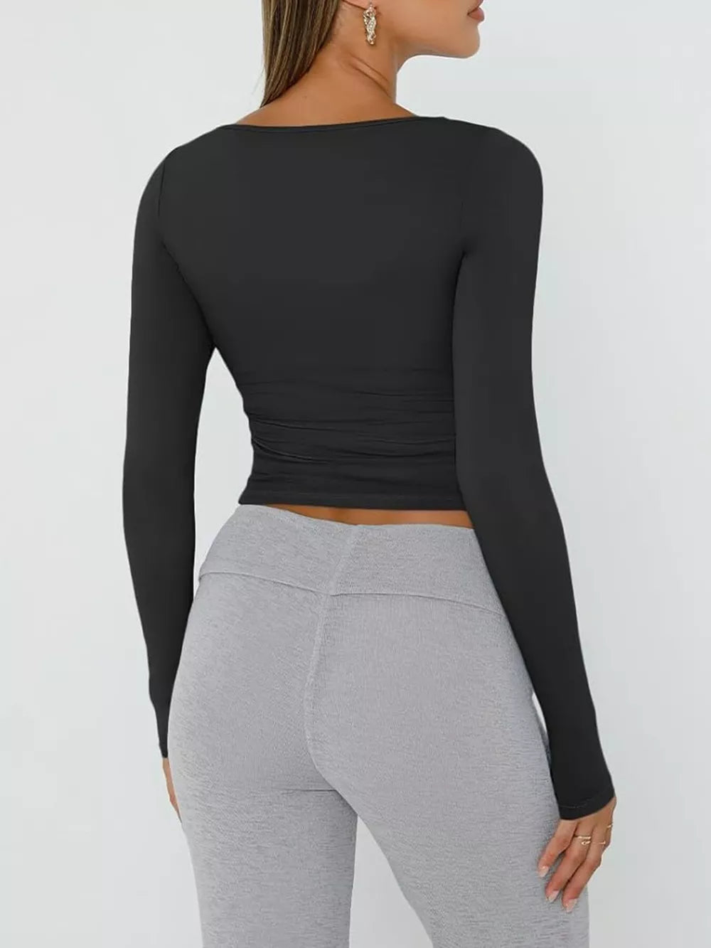 Black long sleeve cropped t-shirt with ruching detail at the waist