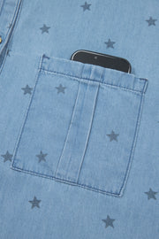Light blue denim shirt with dark star print and a phone in the chest pocket.