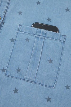 Light blue denim shirt with dark star print and a phone in the chest pocket.