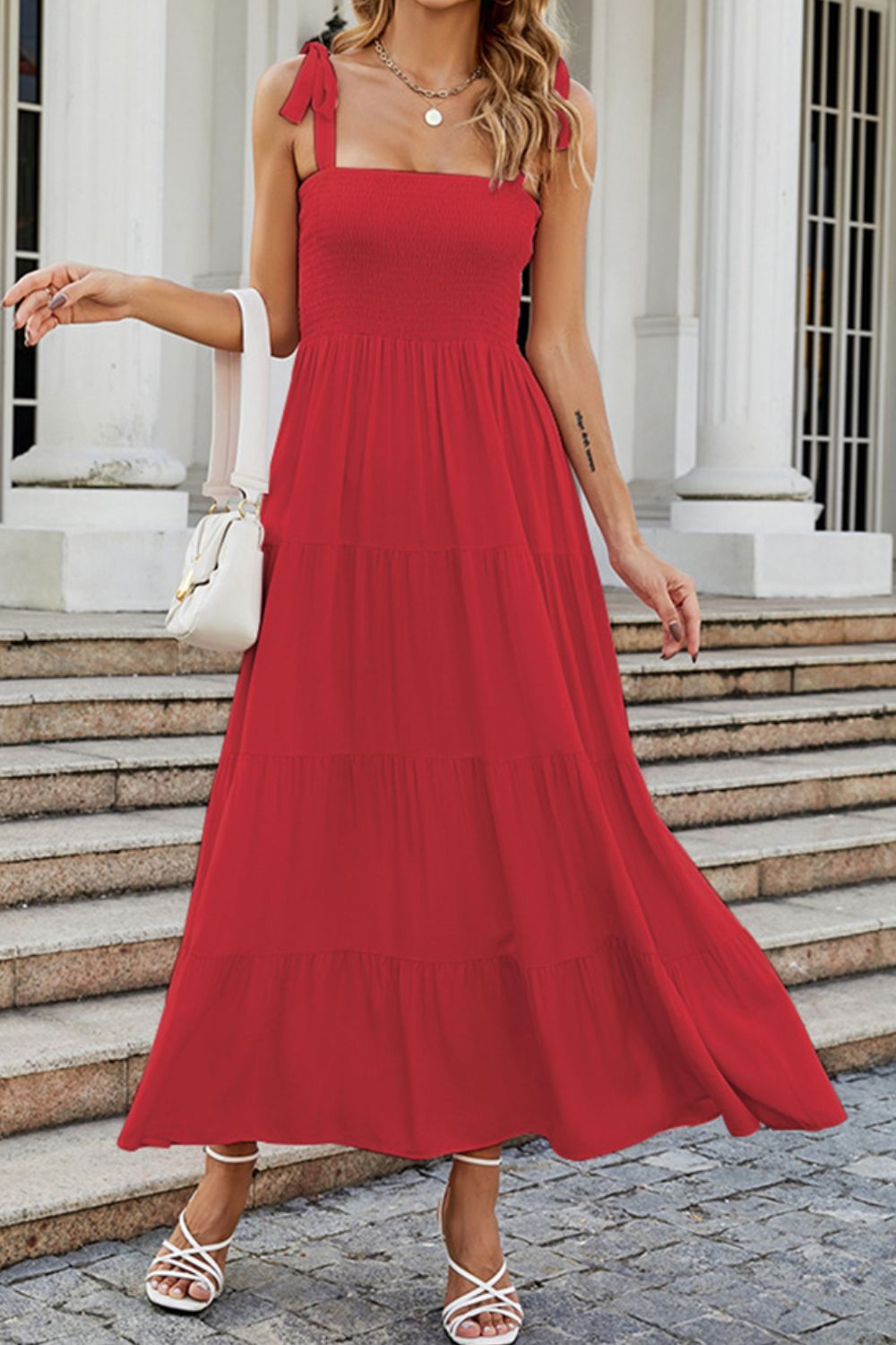Red tiered ruffle smocked bodice maxi dress with tie straps.