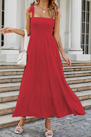 Red tiered ruffle smocked bodice maxi dress with tie straps.