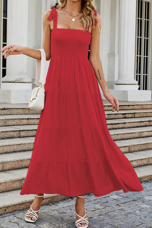 Red tiered ruffle smocked bodice maxi dress with tie straps.