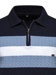 Chevron stripe zip polo in dark navy, light blue, and white with textured fabric.