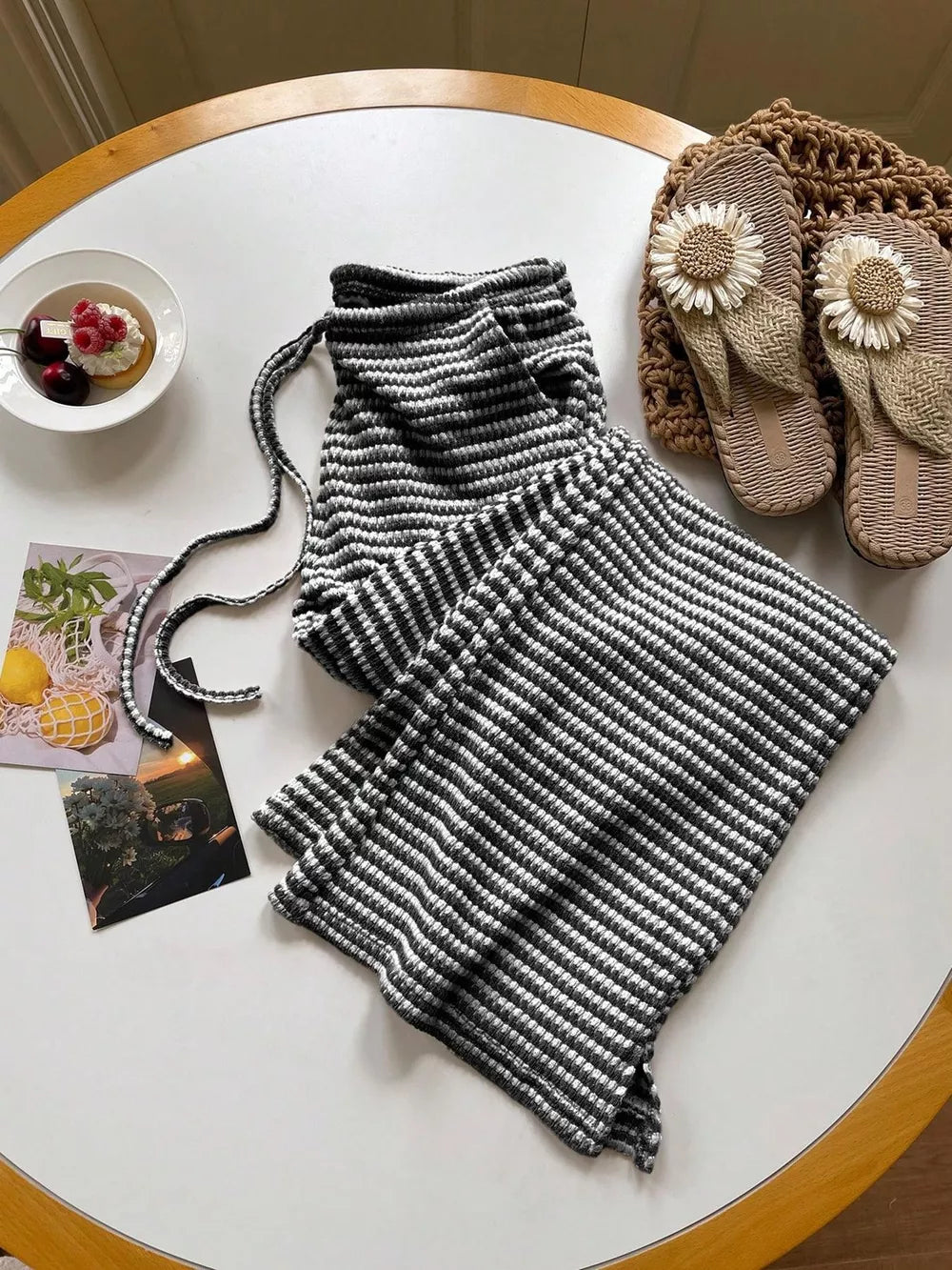Effortless striped maternity wide leg pants in black and white with drawstring waist.