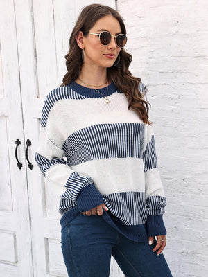 Striped knit crewneck sweater in navy and white with ribbed trim and cuffs.