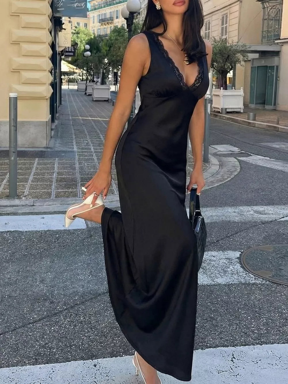 Black lace-trimmed sleeveless maxi gown with a V-neckline and cinched waist.