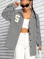 Black houndstooth varsity jacket with a white 'S' patch and button front.