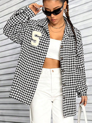 Black houndstooth varsity jacket with a white 'S' patch and button front.