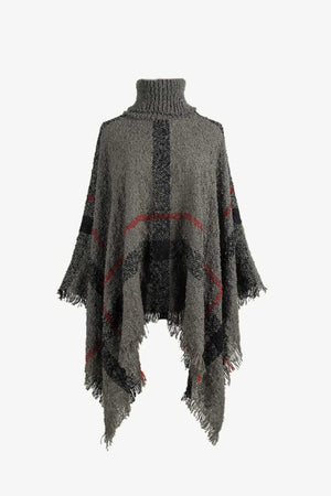 Textured plaid turtleneck cape in charcoal acrylic with fringe hem and red accents.