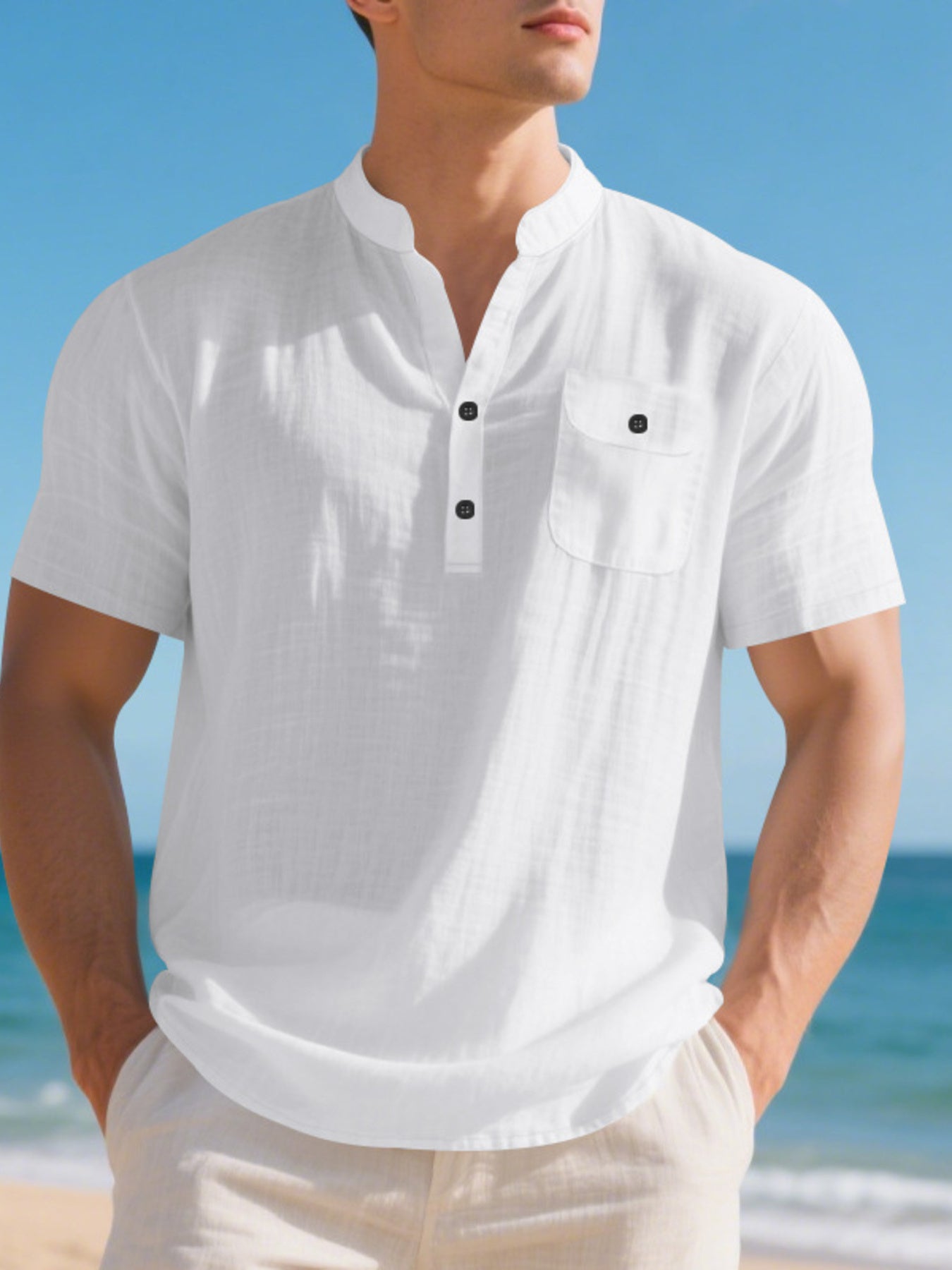 White cotton band-collar short-sleeve shirt with button-down placket and chest pocket.