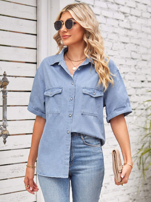 Relaxed light denim shirt jacket with cuffed sleeves and buttoned chest pockets.