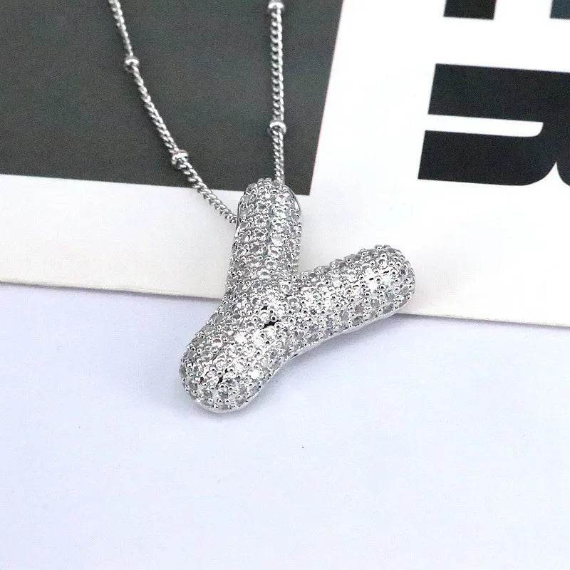 Pave initial pendant necklace with beaded chain, featuring a stylized letter Y.