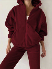Burgundy fleece zip-up hoodie with pockets and matching joggers.