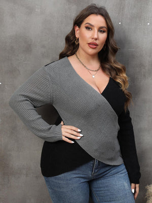 Colorblock crossover knit sweater in dark gray and black acrylic with a deep V-neck.