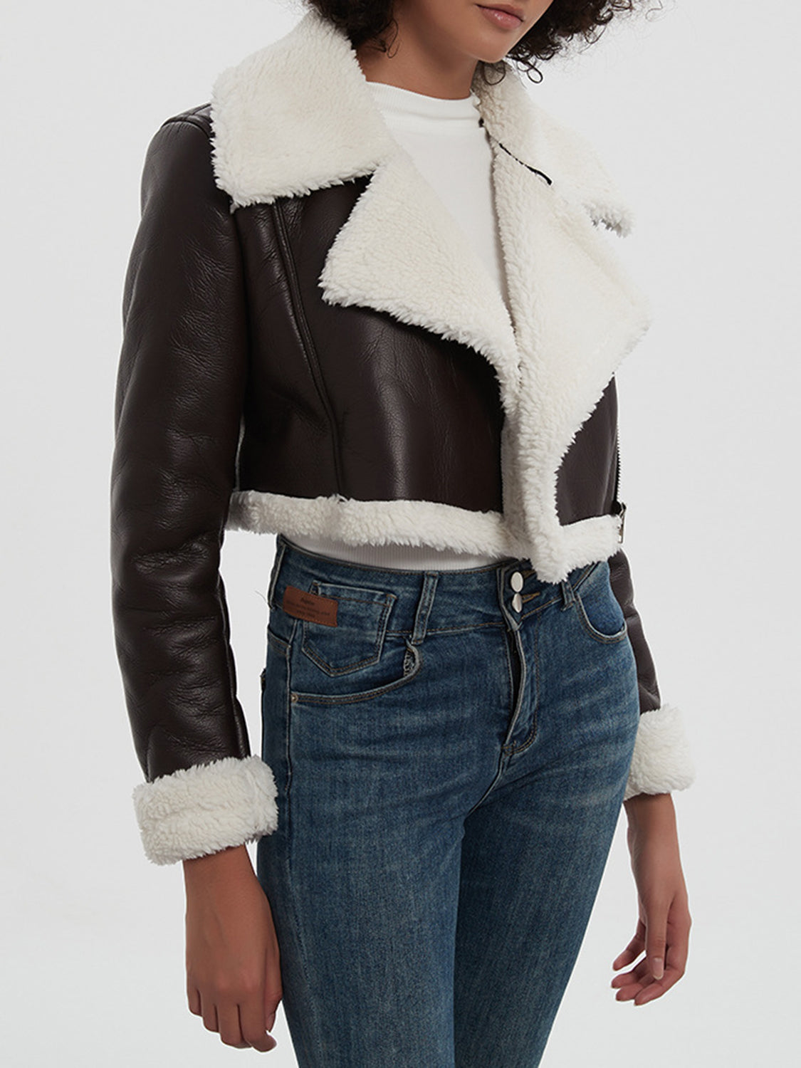 Cropped aviator jacket in brown with white shearling trim and collar.