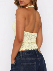 Floral lace halter top in pastel yellow with a backless design.