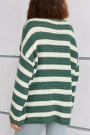 Green and white striped boat neck knit sweater with a textured crochet stitch.
