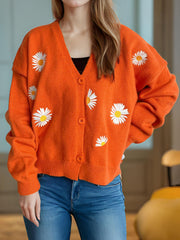 Orange acrylic knit oversized cardigan with daisy embroidery and buttons