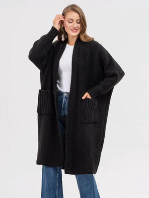 Black oversized knit cocoon cardigan with pockets and ribbed cuffs.