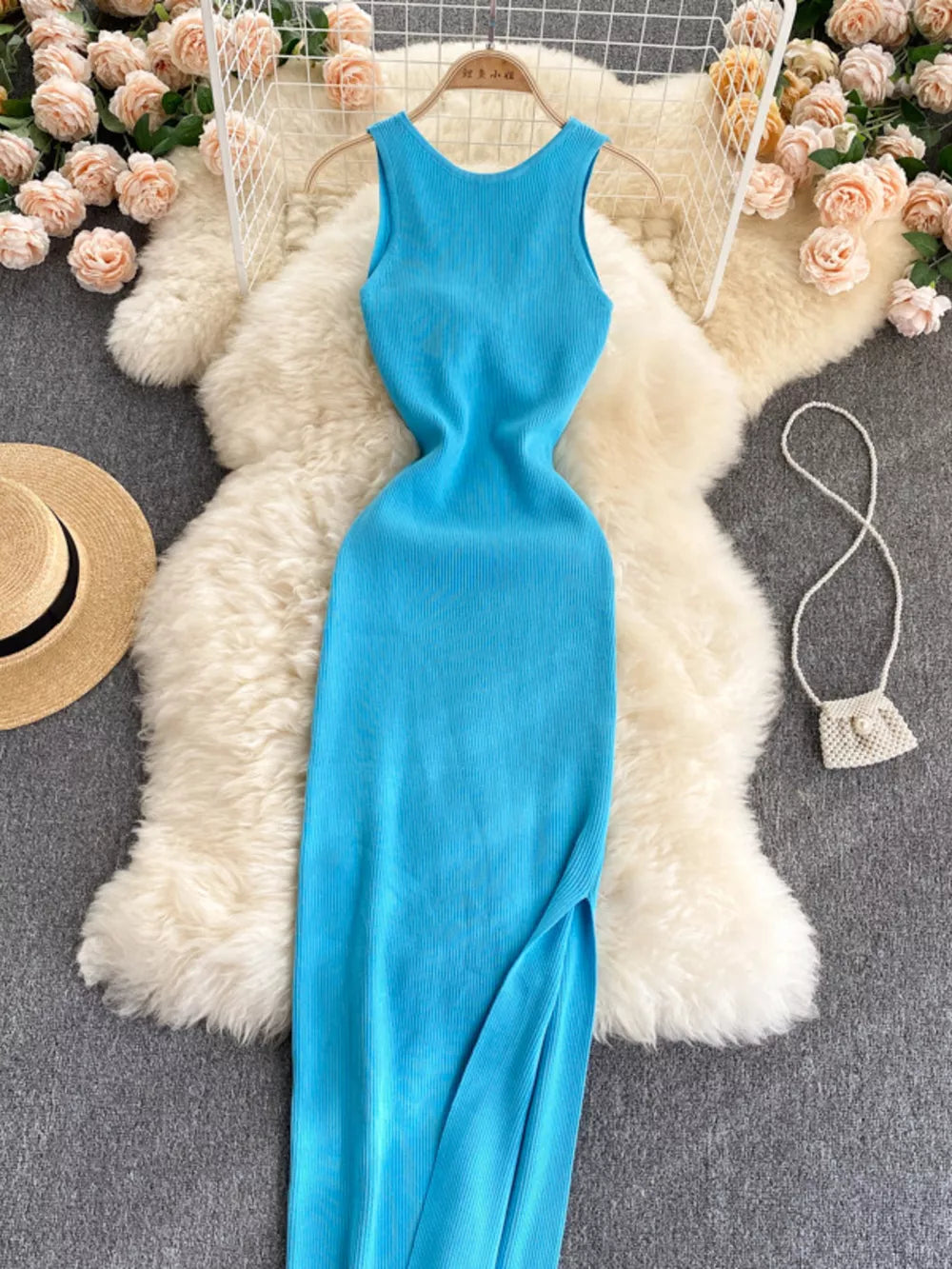 Light blue ribbed knit midi dress with a cutout back and side slit.