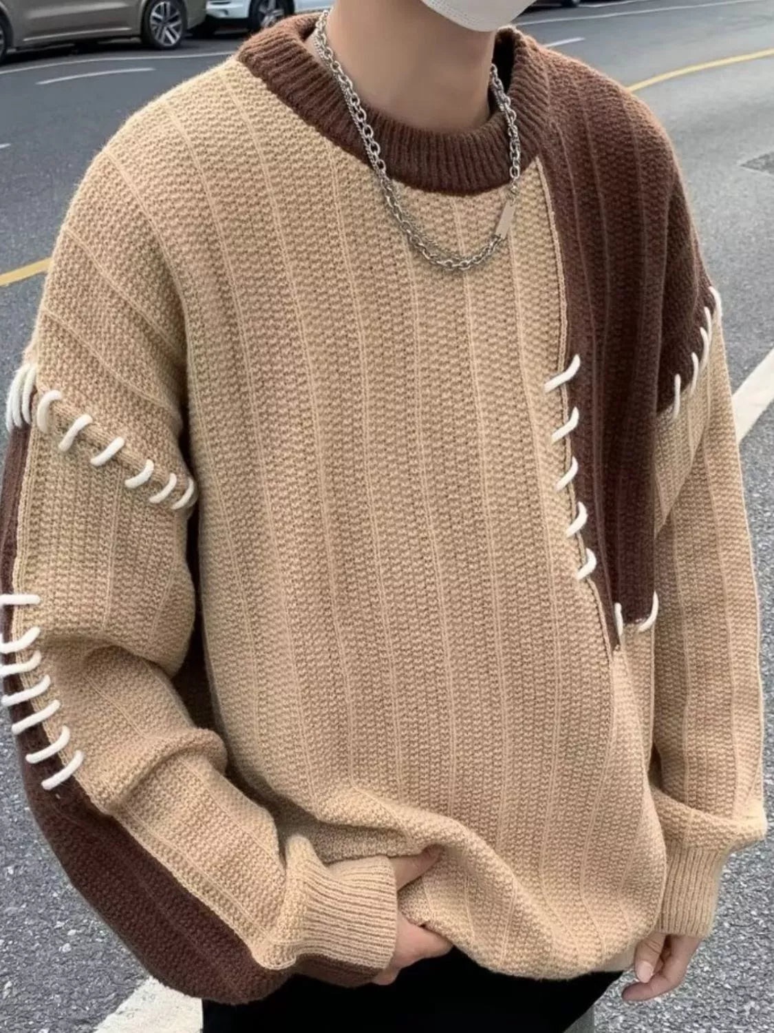 Oversized beige and brown color block sweater with white contrast stitching detail.