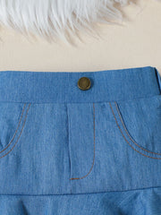 Toddler denim skirt with button closure and contrast stitching on pockets.