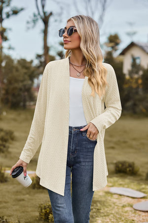Textured knit drape-front cardigan in ivory with long sleeves and an open front.