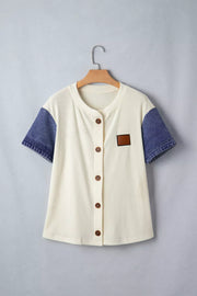 Cream ribbed knit maternity shirt with short denim sleeves, button front, and chest patch.