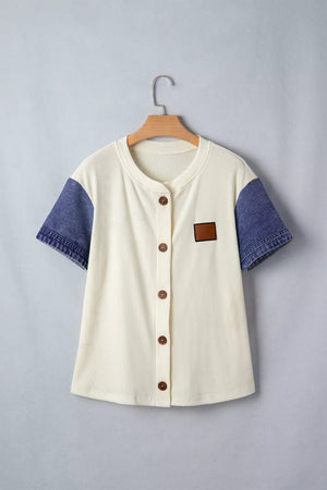 Cream ribbed knit maternity shirt with short denim sleeves, button front, and chest patch.
