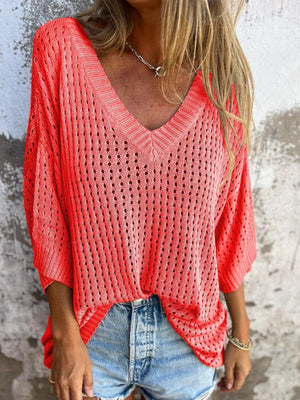 Open-knit V-neck relaxed beach pullover in strawberry with a relaxed fit and airy texture.