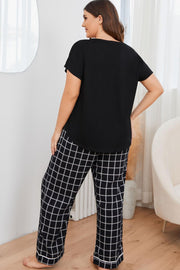 Black grid-print lounge set with Henley top and relaxed fit pants.